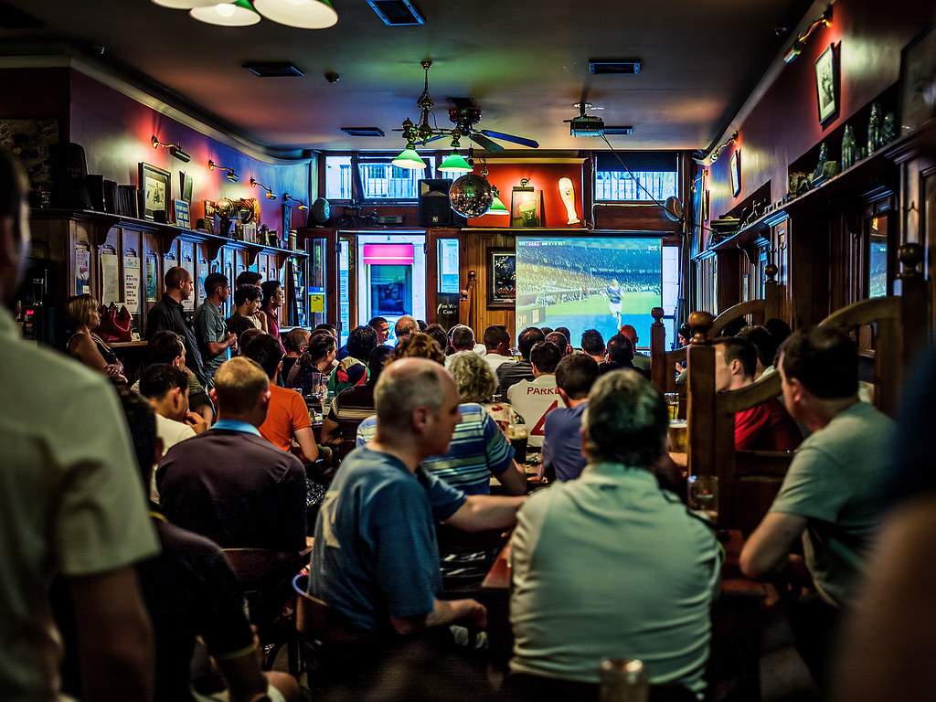 Fig: A mostly English crowd watching a game of football in an Irish Pub in Lisbon